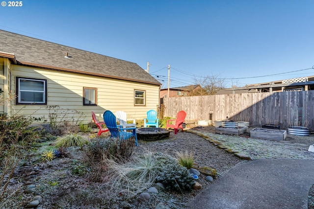 view of yard with a fire pit