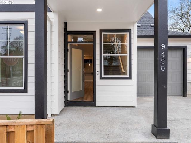 view of exterior entry featuring a garage