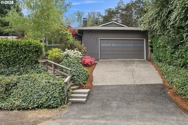garage featuring driveway
