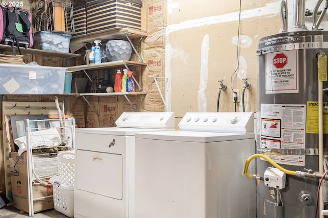 laundry area with water heater, laundry area, and washing machine and clothes dryer