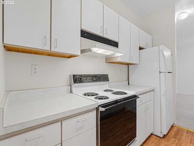 4320 S Corbett Ave Unit 206, Portland, OR 97239 - kitchen featuring electric range, light wood-type flooring, light countertops, and white cabinets