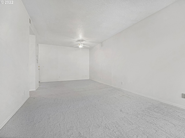 4320 S Corbett Ave Unit 206, Portland, OR 97239 - carpeted spare room featuring ceiling fan, a textured ceiling, and baseboards
