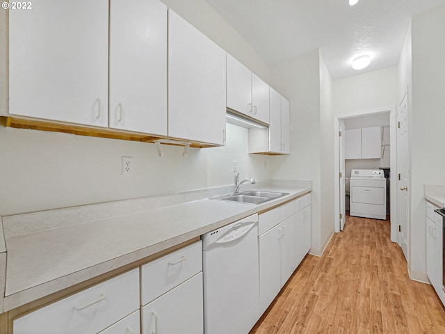 4320 S Corbett Ave Unit 206, Portland, OR 97239 - kitchen with dishwasher, washer / clothes dryer, a sink, and light countertops