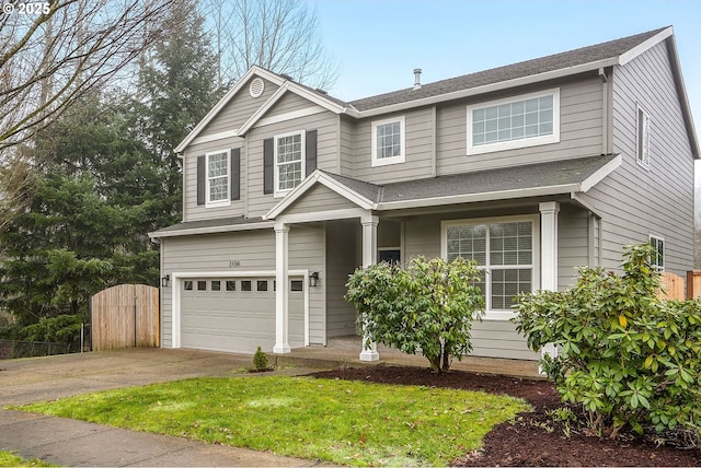 view of front of house with a garage and a front lawn