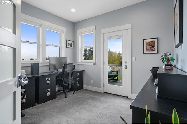 office space with healthy amount of natural light, carpet flooring, baseboards, and recessed lighting