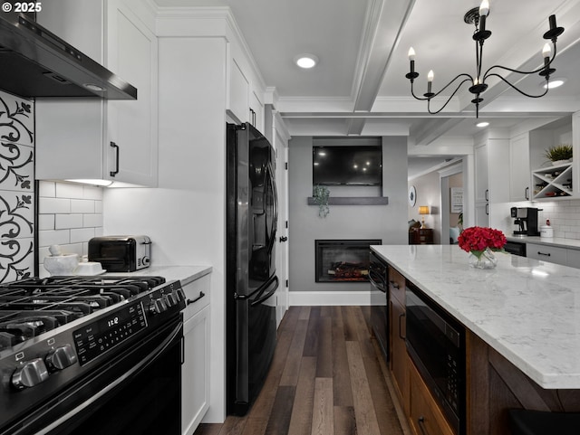 kitchen featuring ventilation hood, white cabinetry, beam ceiling, and black appliances