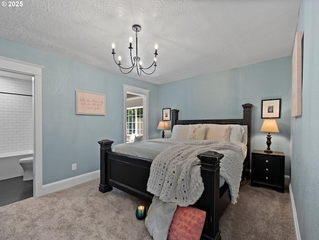 bedroom with a notable chandelier, carpet flooring, a textured ceiling, and ensuite bath