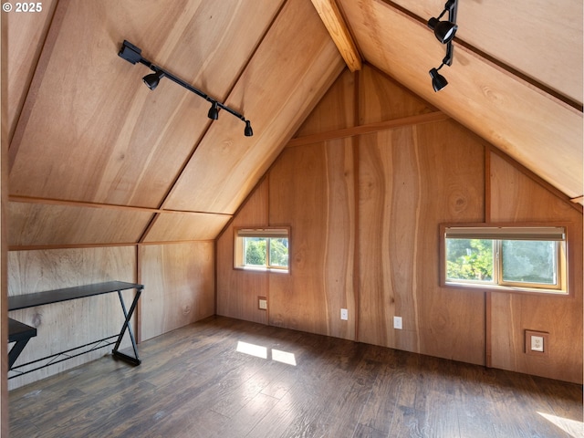 bonus room with lofted ceiling, dark hardwood / wood-style floors, and wood walls