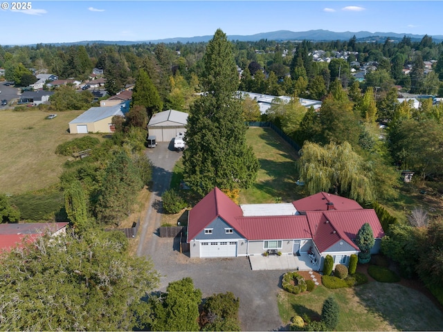 birds eye view of property with a mountain view