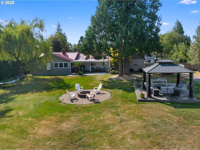 view of yard with a patio area, a gazebo, and a fire pit