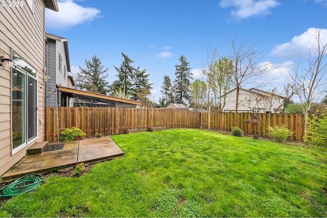 view of yard featuring a fenced backyard and a patio