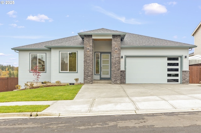3200 N Abernathy Cir, Ridgefield, WA 98642 - prairie-style home with a garage, a shingled roof, stone siding, and concrete driveway