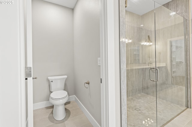 3200 N Abernathy Cir, Ridgefield, WA 98642 - bathroom with toilet, tile patterned flooring, a stall shower, and baseboards