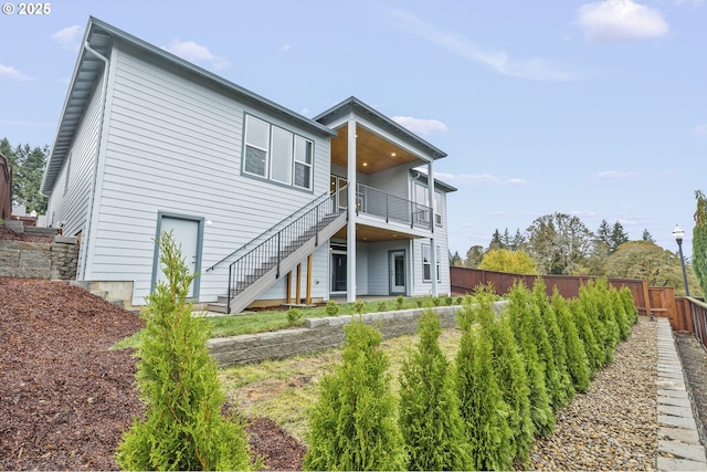 3200 N Abernathy Cir, Ridgefield, WA 98642 - rear view of property featuring stairs and a fenced backyard