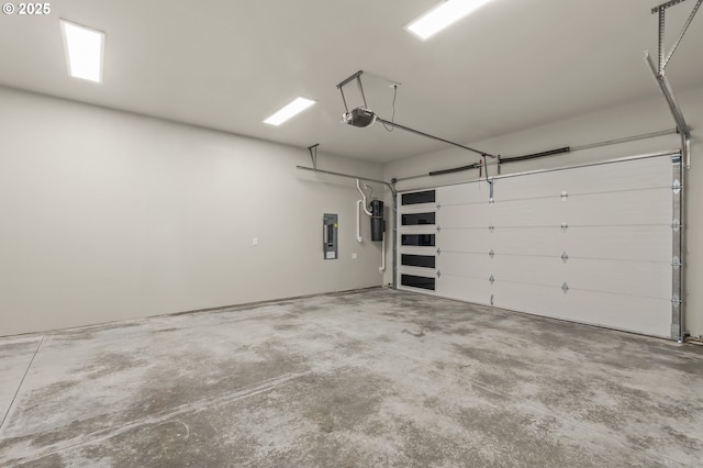 3200 N Abernathy Cir, Ridgefield, WA 98642 - garage with a garage door opener, electric panel, and a central vacuum unit