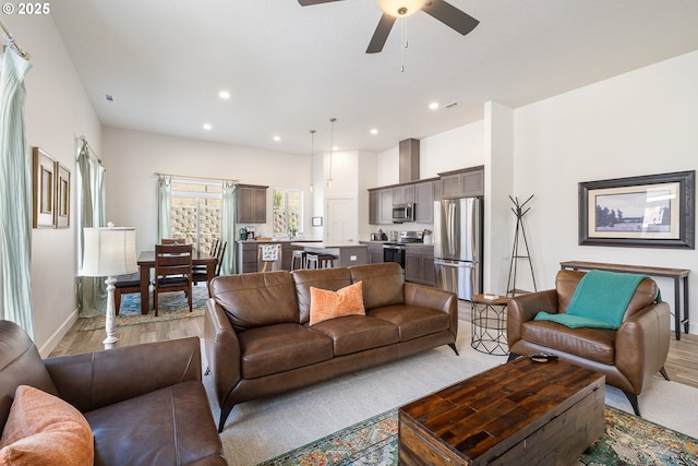 881 E Autumn Ave, Hermiston, OR 97838 - living room with light wood-style floors, ceiling fan, recessed lighting, and baseboards
