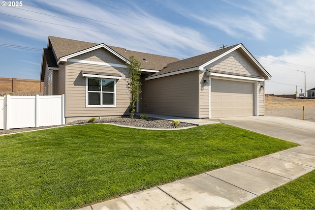 881 E Autumn Ave, Hermiston, OR 97838 - single story home with concrete driveway, a garage, and a shingled roof