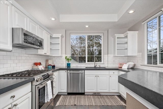 kitchen featuring white cabinetry and appliances with stainless steel finishes