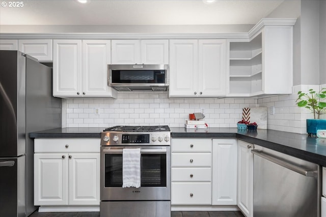 kitchen with white cabinetry, backsplash, and stainless steel appliances