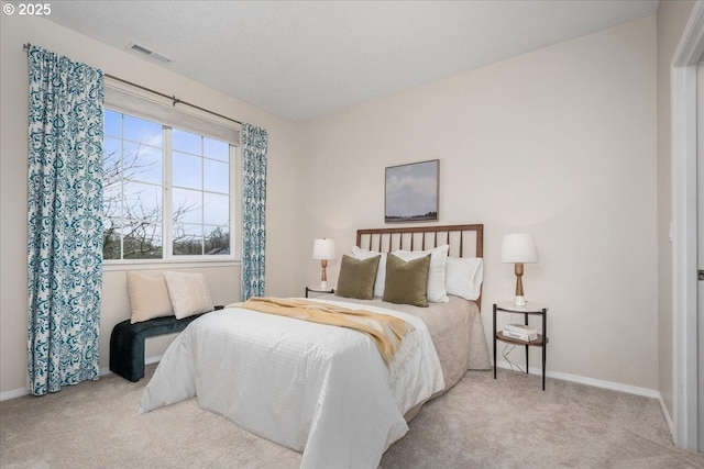 carpeted bedroom with a textured ceiling