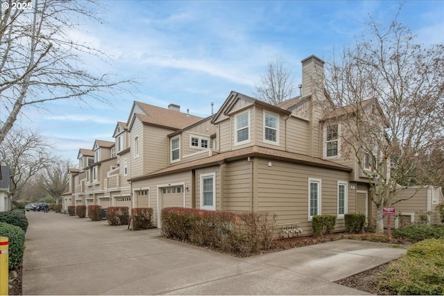 view of side of property featuring a garage