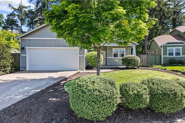view of property hidden behind natural elements featuring fence, concrete driveway, an attached garage, and board and batten siding