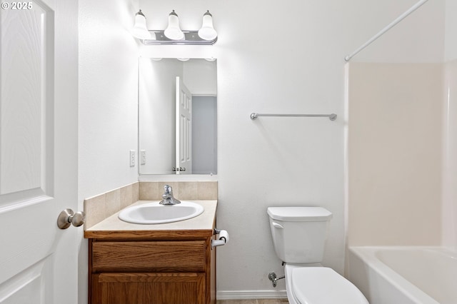 bathroom with toilet and vanity