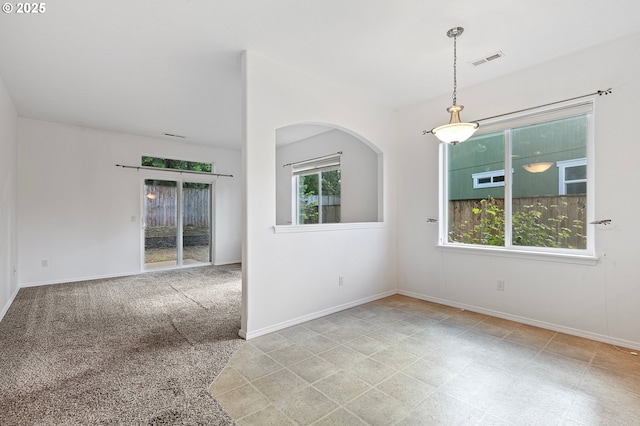 spare room featuring baseboards