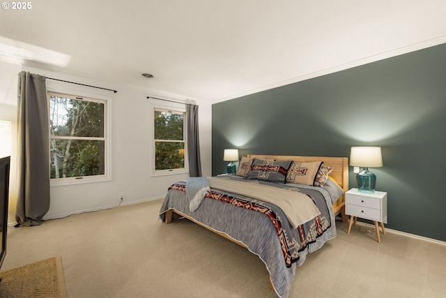 bedroom featuring carpet floors and crown molding