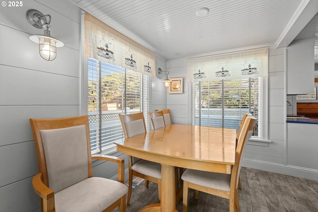 dining space with wood finished floors