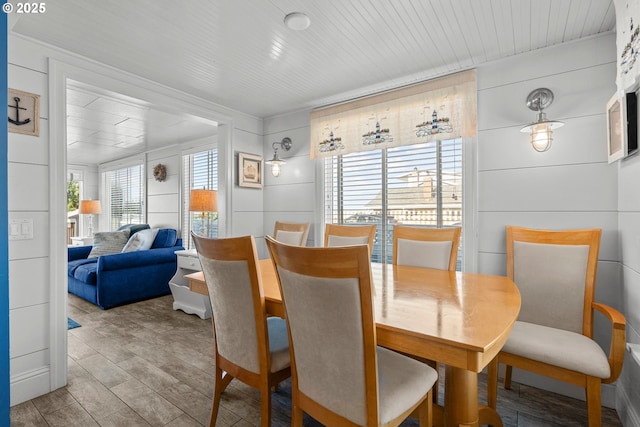dining space featuring a decorative wall