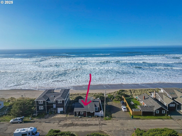 drone / aerial view featuring a residential view and a water view