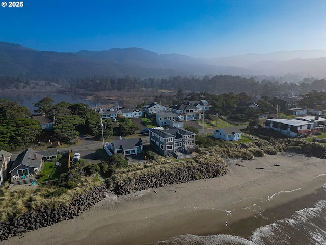 birds eye view of property with a residential view and a water and mountain view