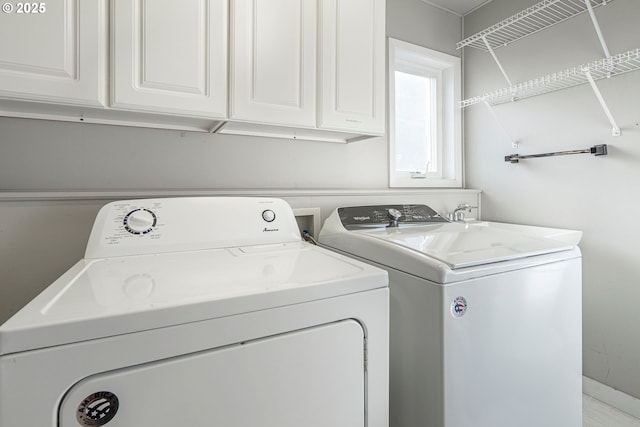 695 N Pacific St, Rockaway Beach, OR 97136 - washroom featuring washer and clothes dryer and cabinet space