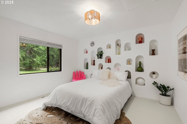 bedroom featuring visible vents