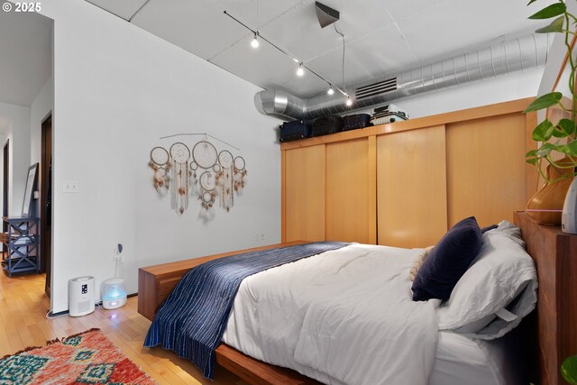 1410 NW Kearney St Unit 614, Portland, OR 97209 - bedroom featuring light wood-style flooring and track lighting