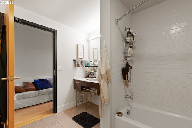 1410 NW Kearney St Unit 614, Portland, OR 97209 - ensuite bathroom featuring bathing tub / shower combination, vanity, and tile patterned floors