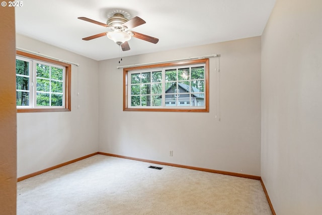 7678 Pine Tree Ln SE, Turner, OR 97392 - spare room featuring carpet, baseboards, and a ceiling fan