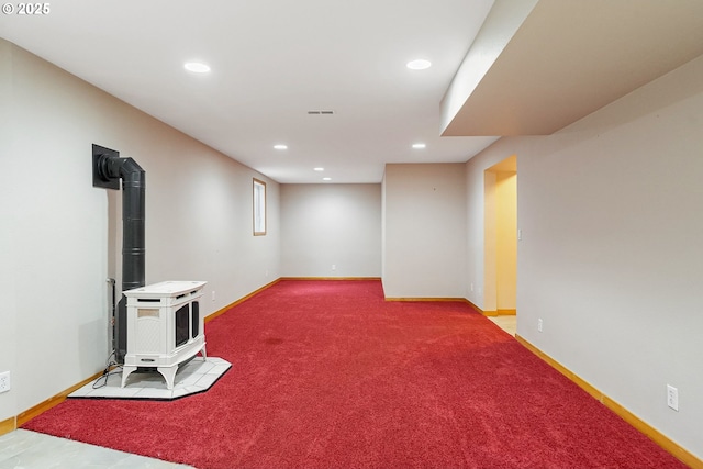 7678 Pine Tree Ln SE, Turner, OR 97392 - finished below grade area with recessed lighting, a wood stove, carpet floors, and baseboards