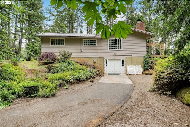 7678 Pine Tree Ln SE, Turner, OR 97392 - single story home with a chimney, driveway, and metal roof