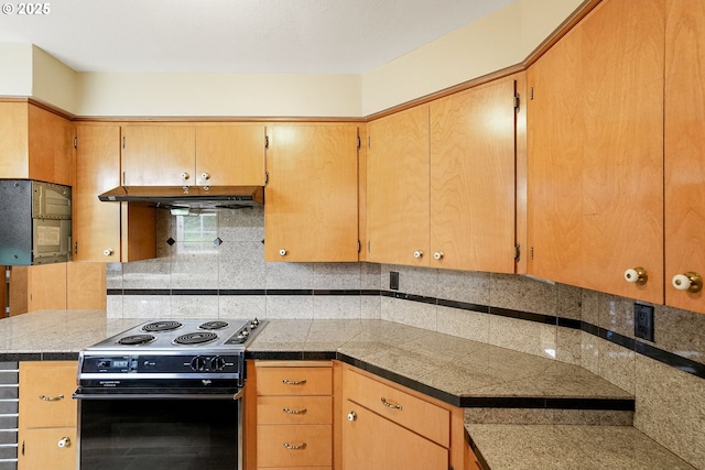7678 Pine Tree Ln SE, Turner, OR 97392 - kitchen featuring black electric range oven, decorative backsplash, tile counters, and under cabinet range hood