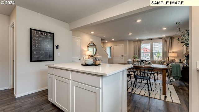 kitchen with dark wood-style floors, recessed lighting, light countertops, and white cabinetry