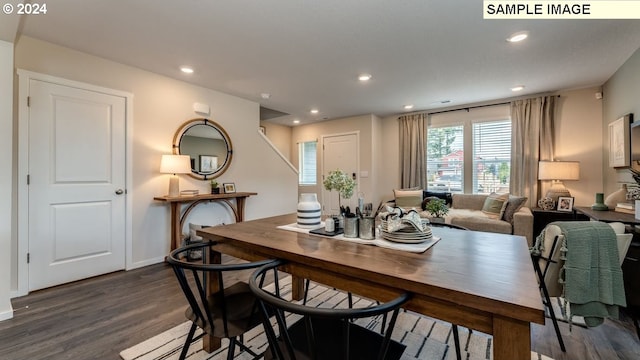 dining room featuring dark wood-style floors, baseboards, and recessed lighting