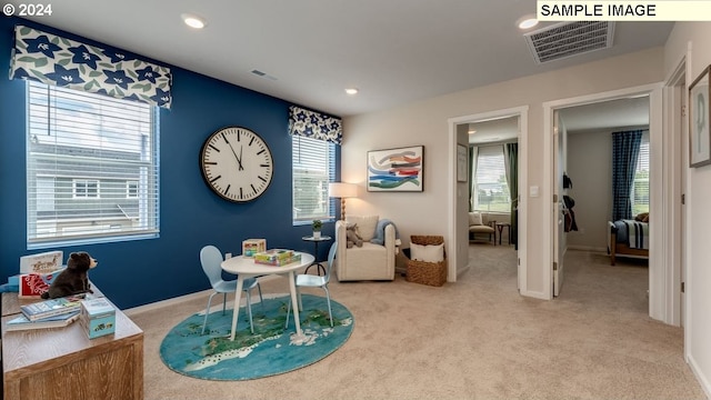 interior space with recessed lighting, visible vents, and light colored carpet