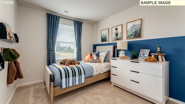 bedroom featuring light carpet, baseboards, and visible vents