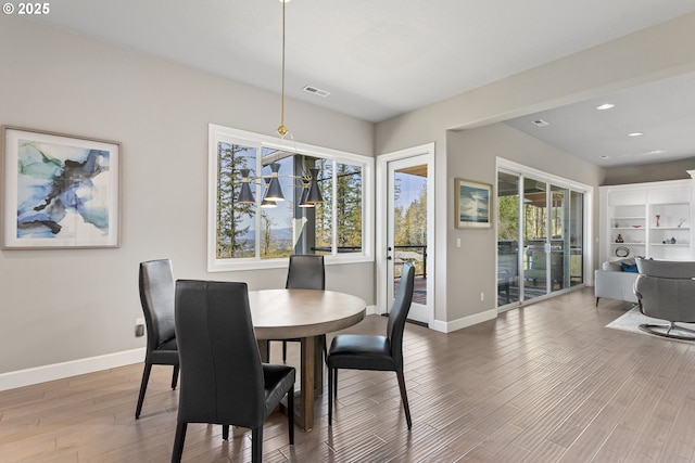 10397 SE Quail Ridge Dr, Happy Valley, OR 97086 - dining area featuring wood finished floors and recessed lighting
