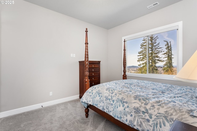 bedroom with baseboards, visible vents, and carpet flooring