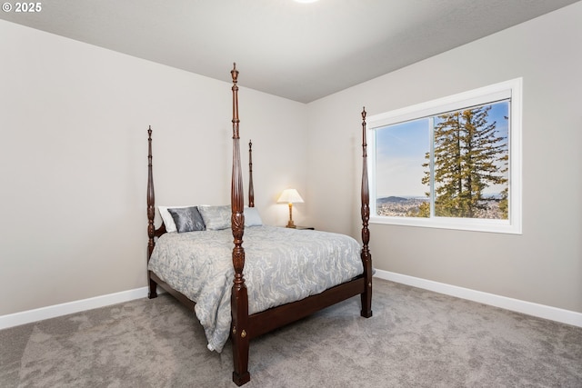 carpeted bedroom with baseboards