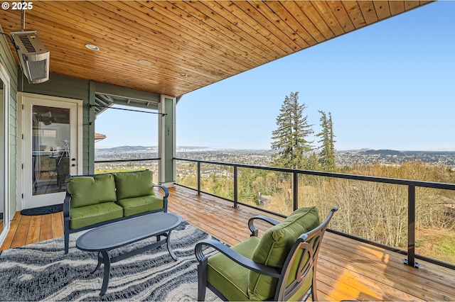 view of wooden balcony with a wooden deck and outdoor lounge area