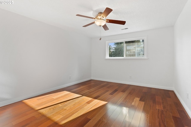 unfurnished room featuring hardwood / wood-style flooring and ceiling fan